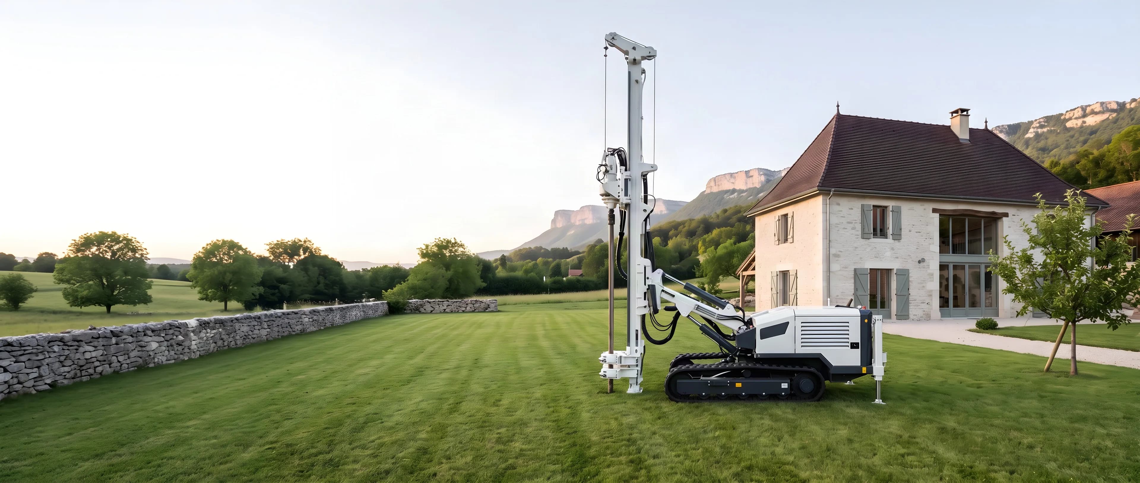 Foreuse légère dans le jardin d'une maison en pierre, pour forer à côté d'un puits à sec